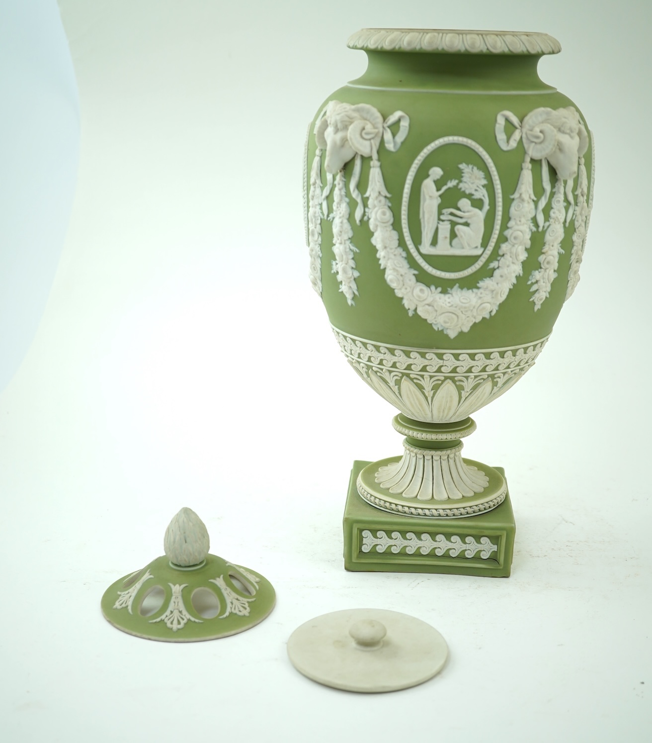 A Wedgwood green jasperware covered pot pourri urn, early 19th century